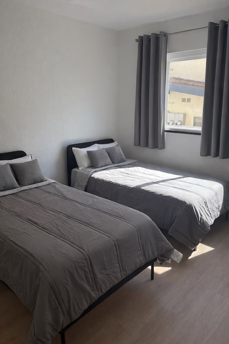 A furnished bedroom with two beds