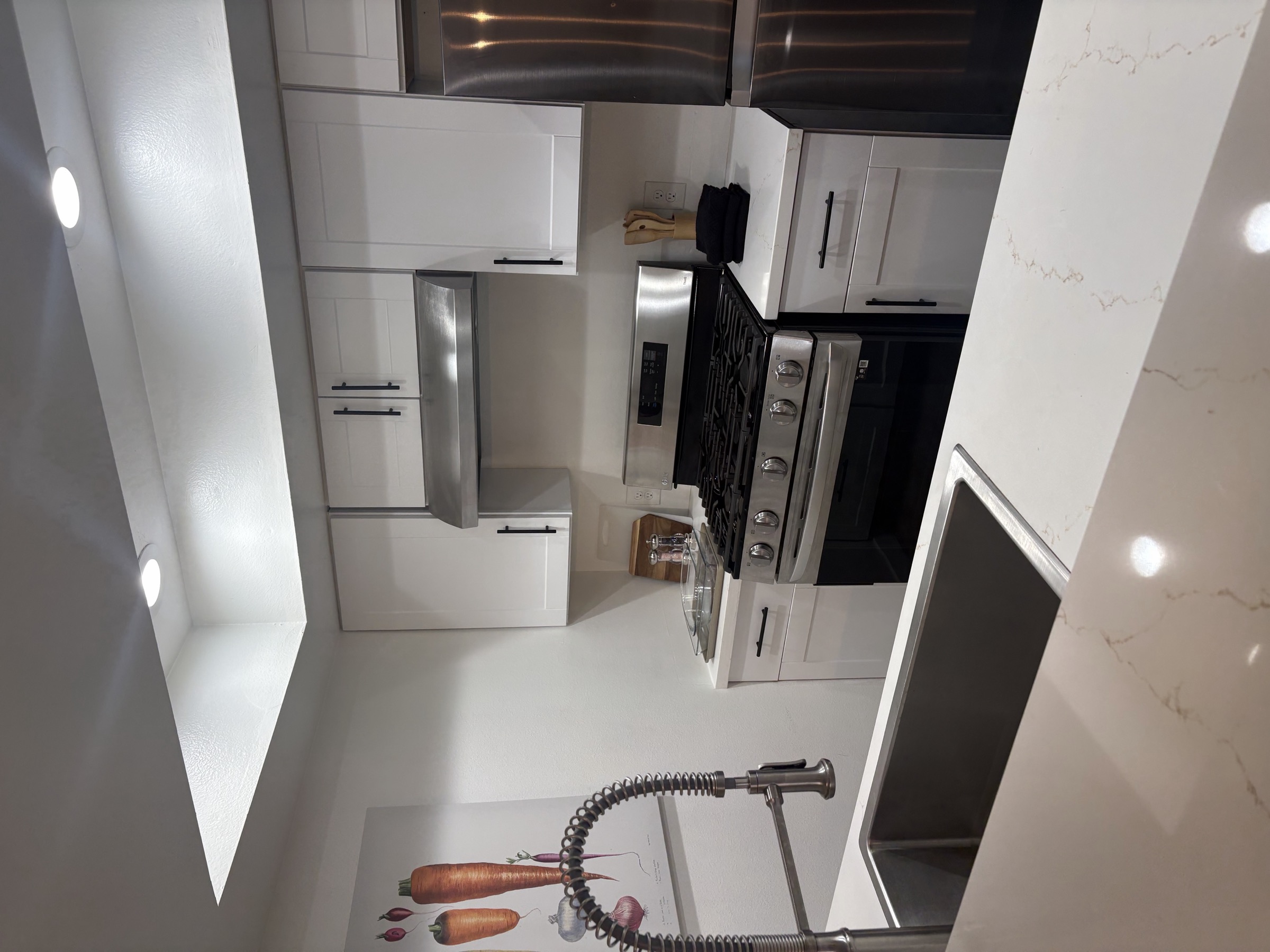 The kitchen, with the range and sink